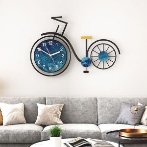 A bicycle-shaped wall clock with a blue ocean-themed clock face as the front wheel, complemented by a black metal frame and artistic details.