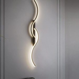 Modern wall lights illuminate a stylish bedroom, enhancing the contemporary decor and creating a warm ambiance.