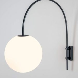 Large round white globe wall light with a curved black stem.